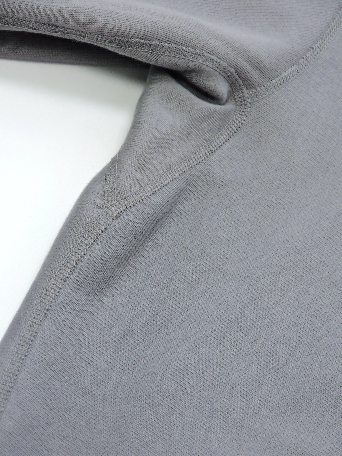 Inseams around the underarms and outseams of the crewneck.