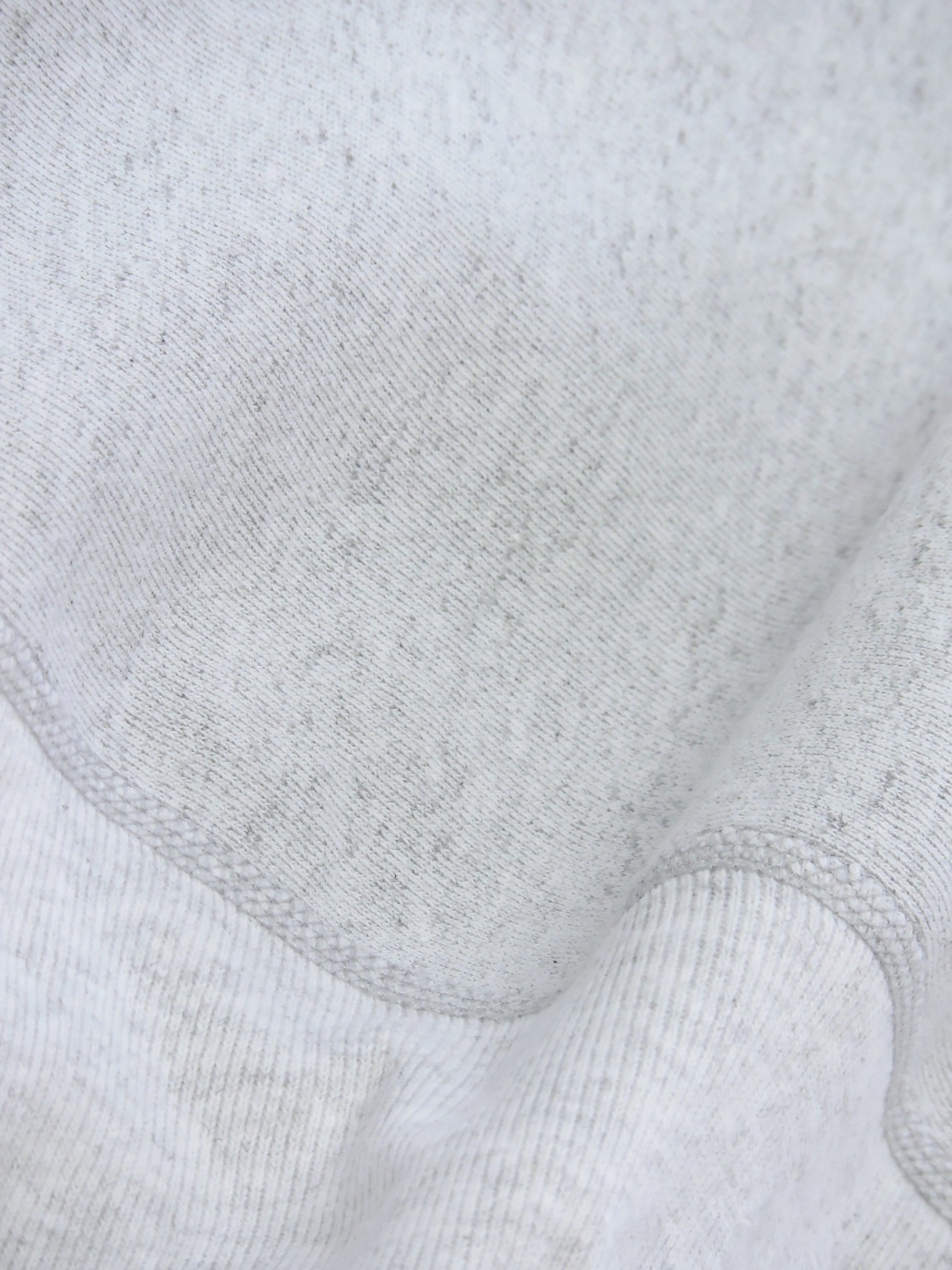 Close up of knitted seams close to the waistband of sweater