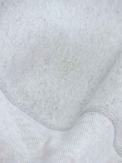 Close up of knitted seams close to the waistband of sweater