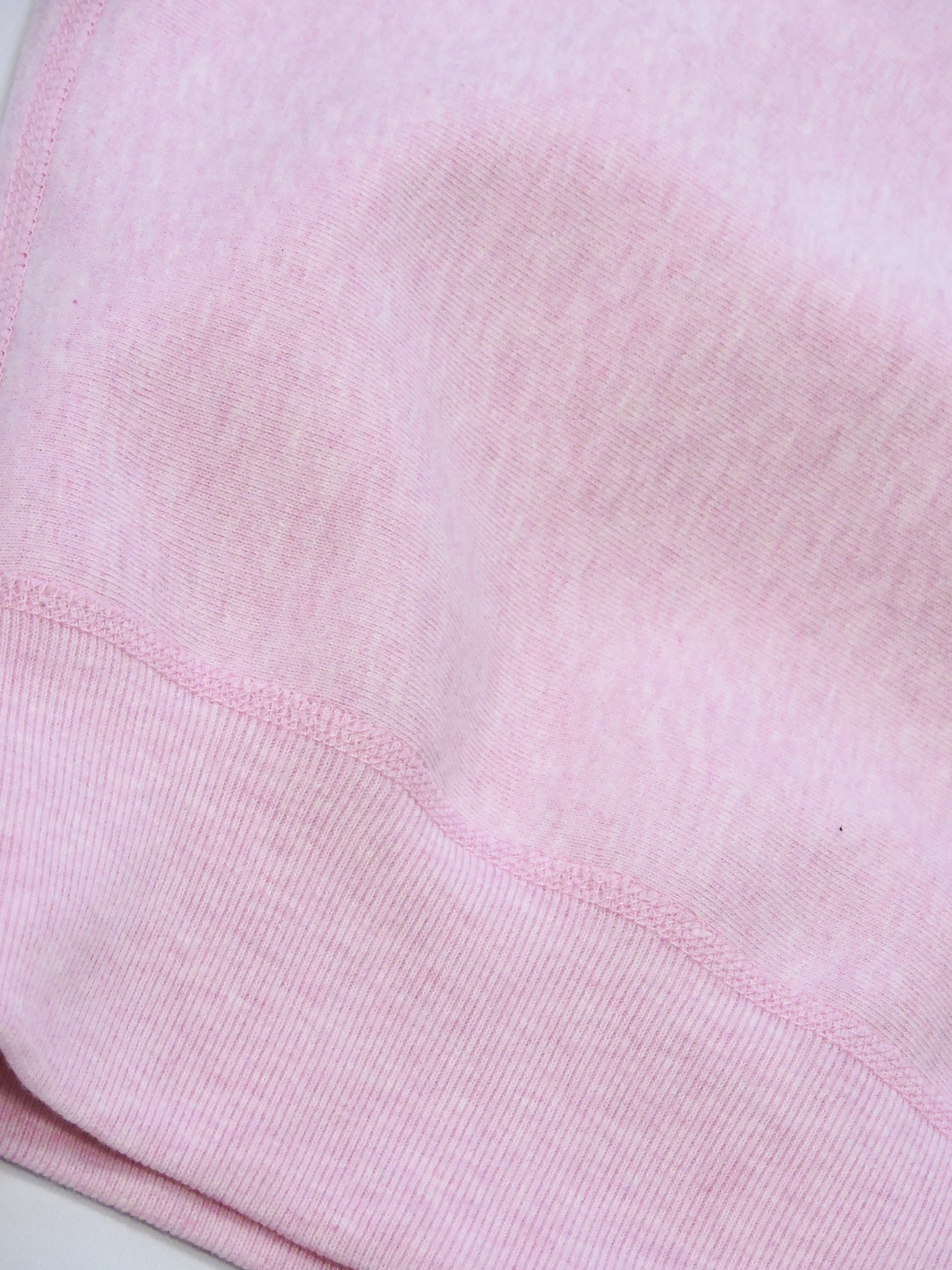 Close up of the waist ribbing and knitted seams