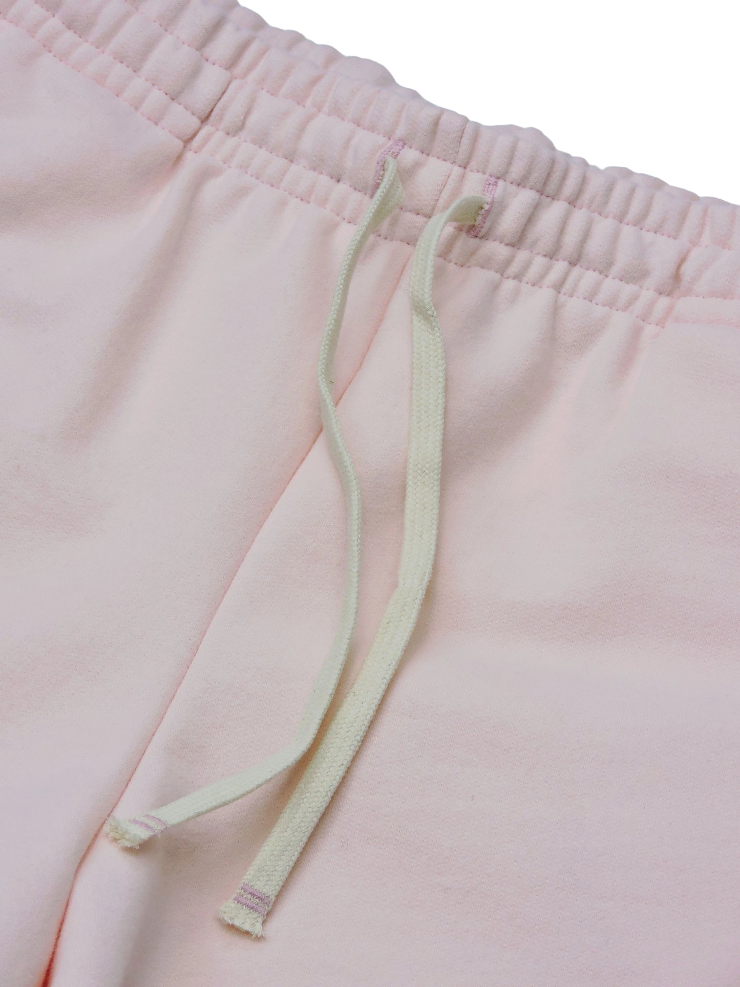 White drawstrings of pink mini short