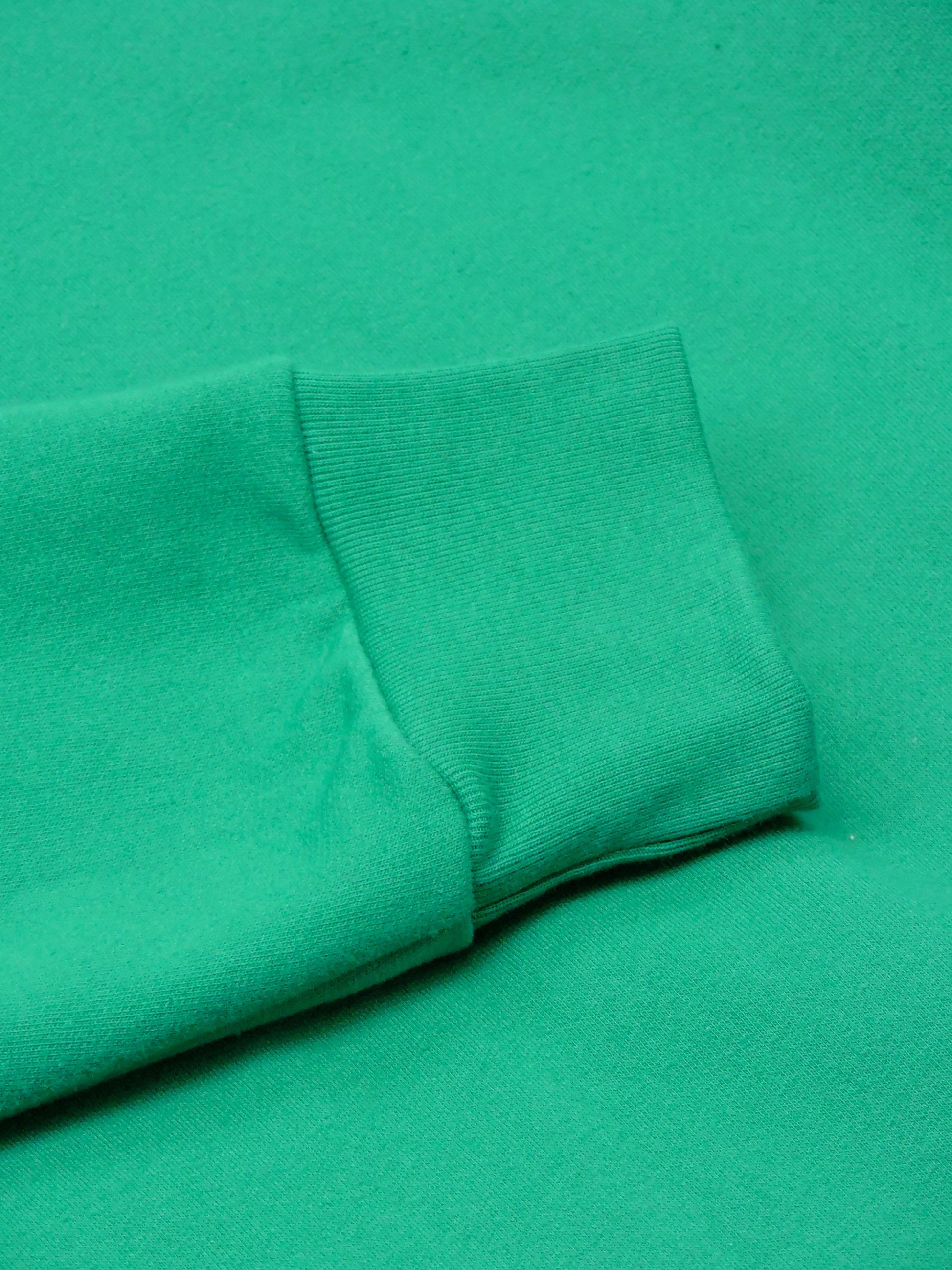 Close up of Emerald Green Crewneck's Fitted Cuffs