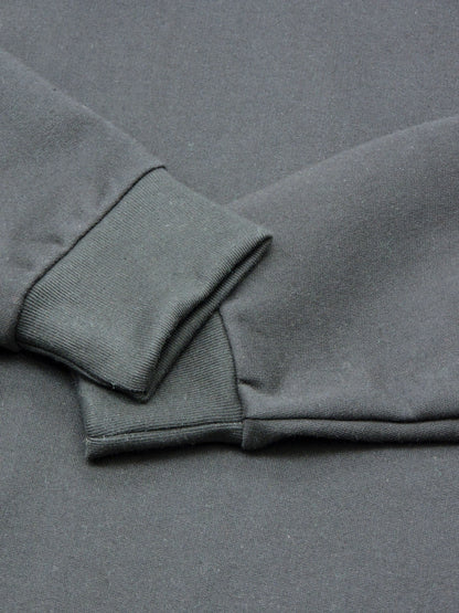 Close-up of ribbed cuffs and the organic cotton fleece material