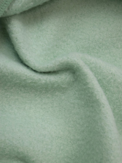 Close up of mint green fleece interior of shorts